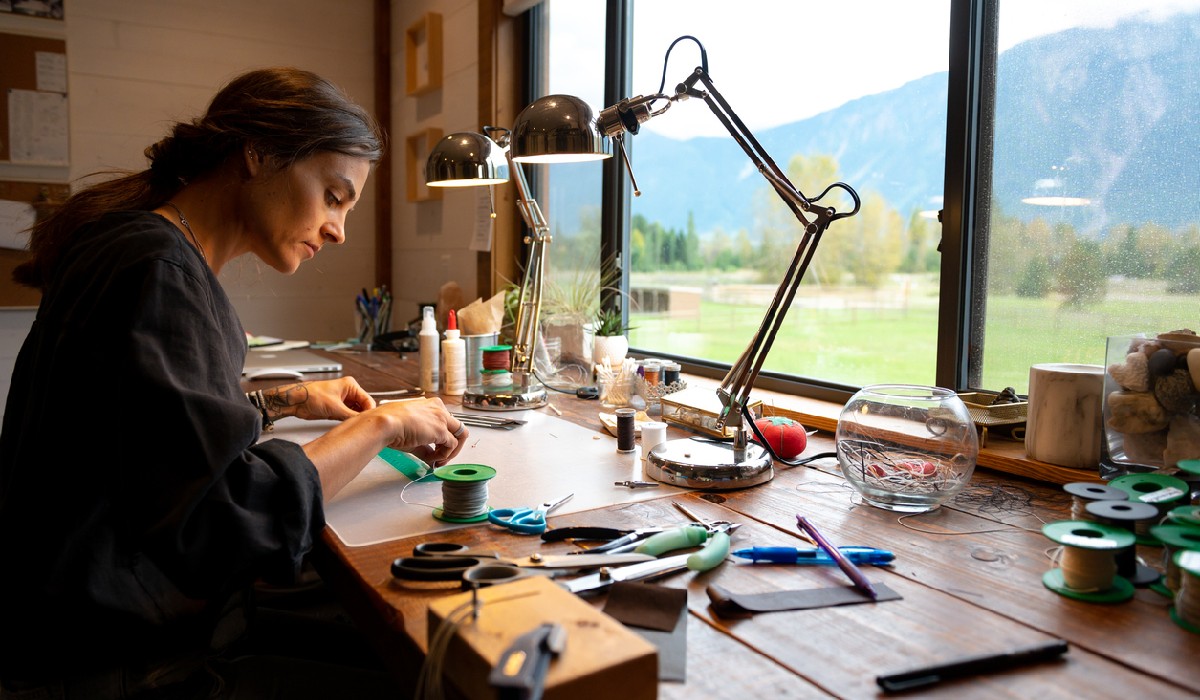 Female jeweller working from her home office