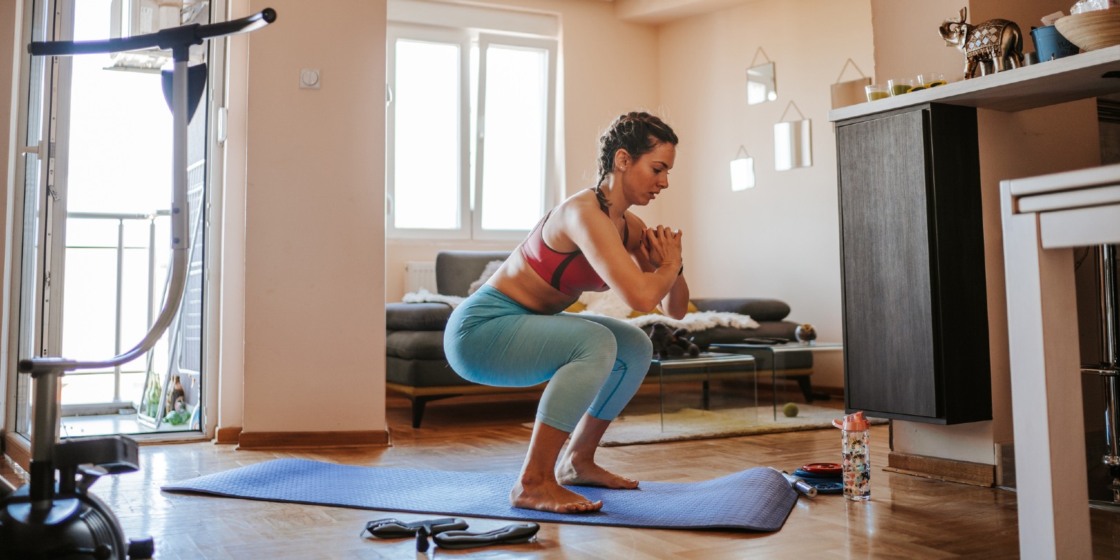 Young woman doing home workout in living room